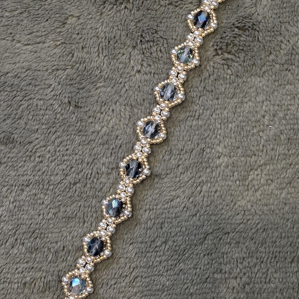 Elegant Gold and Black Bracelet